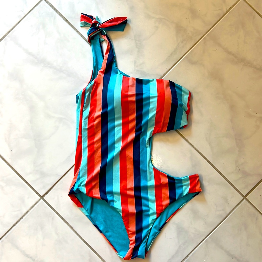 Reversible one piece swim suit with cut outs